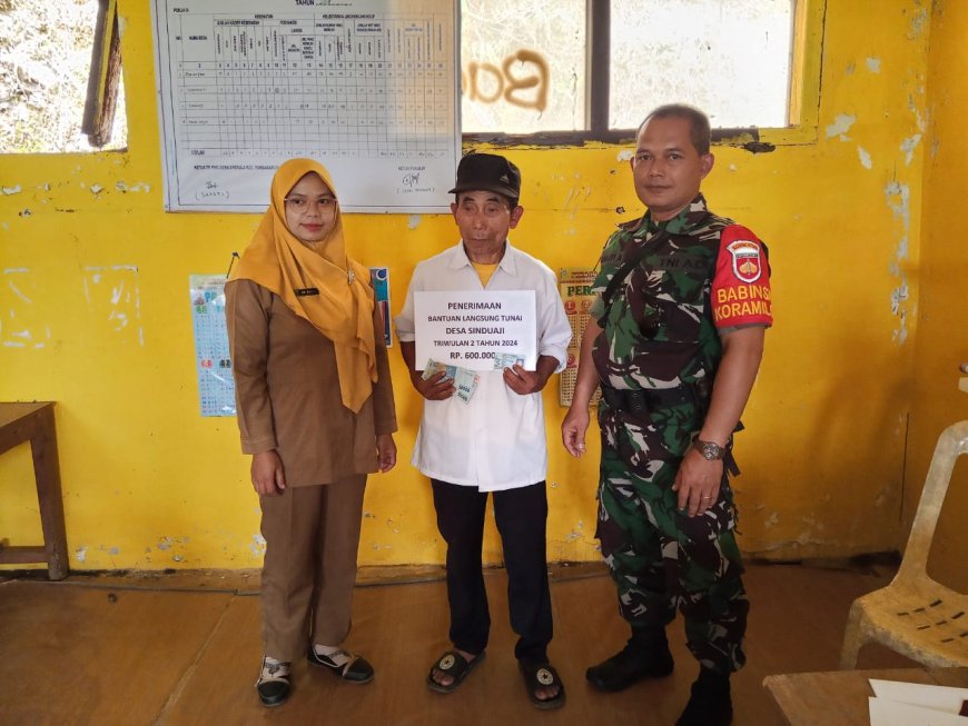 WUJUD PERAN AKTIF,BABINSA DAMPINGI PENYALURAN BLT DANA DESA
